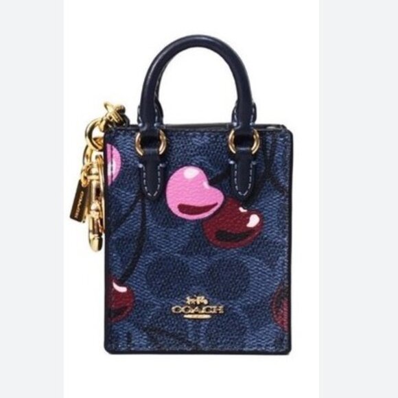 Coach Handbags - Coach North/South Mini Tote Bag Charm In Signature Canvas With Cherry Print